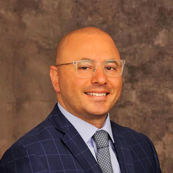 Portrait photo of doctor Alon Shalev, a periodontist in Uptown Dallas